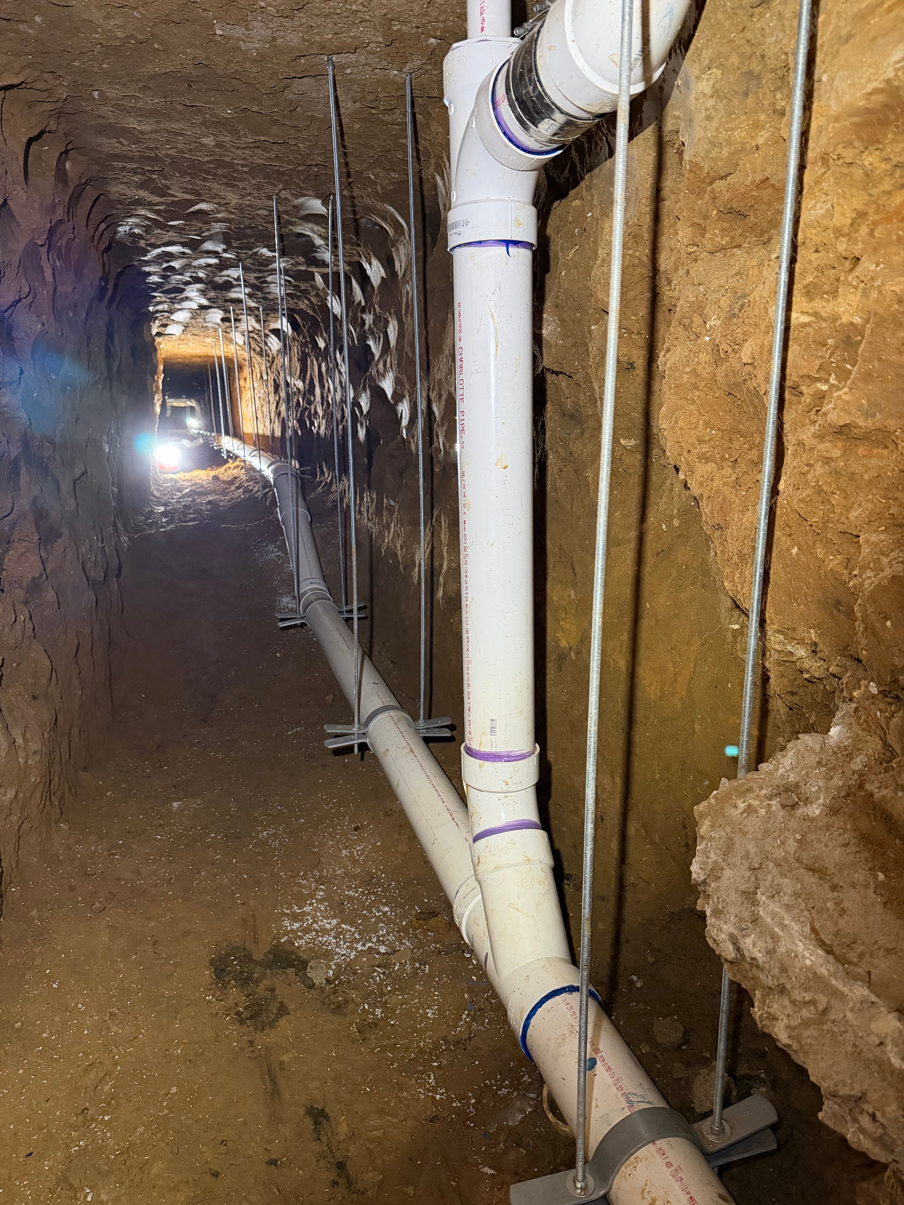 Underground tunnel plumbing pipes