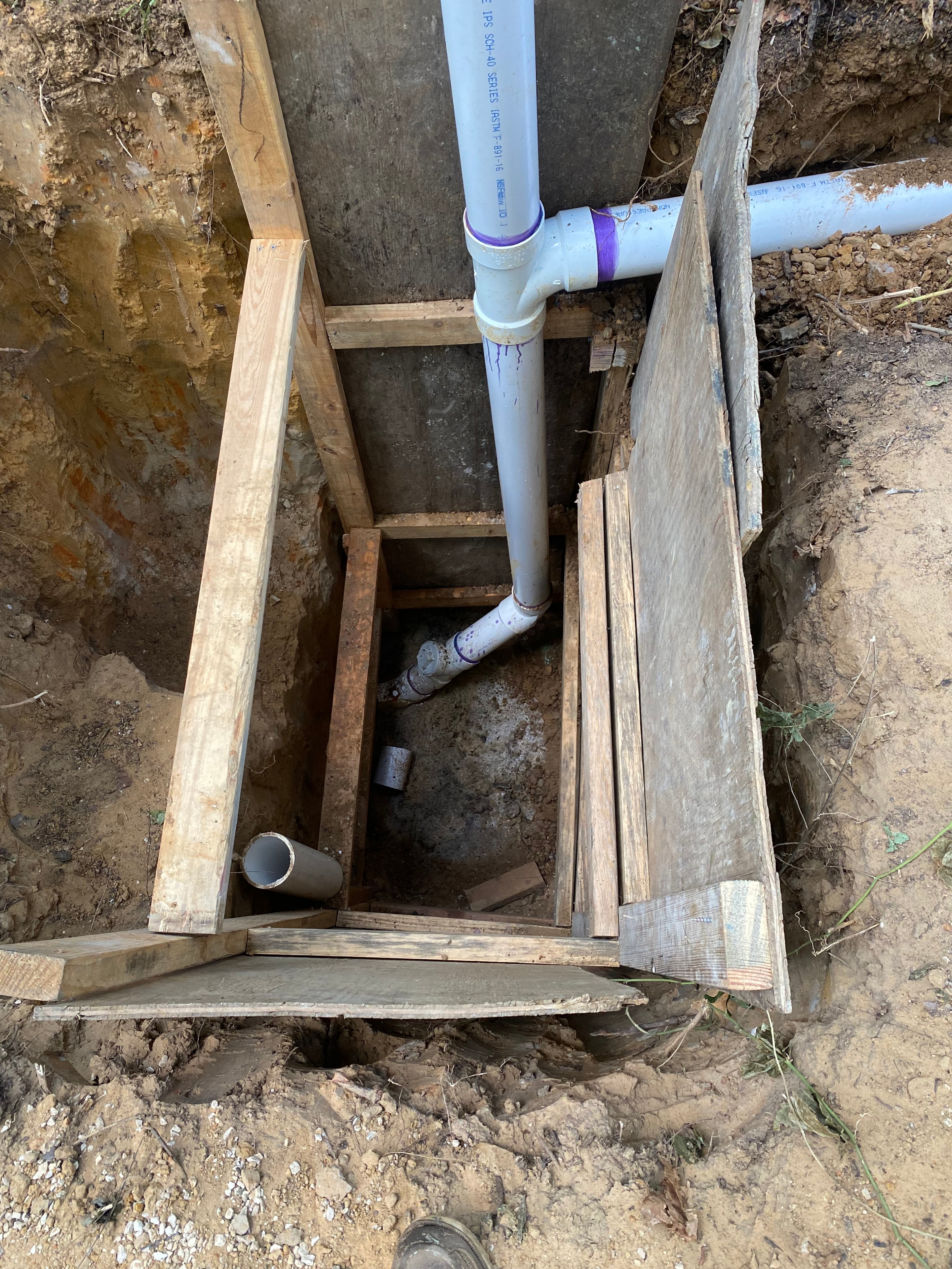 Underground plumbing pipes in trench